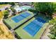 Aerial view of community tennis courts and swimming pool at 9209 Cameron Wood Dr, Charlotte, NC 28210