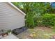 Well-maintained backyard with garden beds and stone path at 9214 N Vicksburg Park Ct, Charlotte, NC 28210