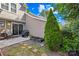 Backyard view with patio, garden, and well-placed landscaping at 9214 N Vicksburg Park Ct, Charlotte, NC 28210