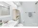 Charming bathroom with a classic vanity, toilet, and towel rack, creating a cozy atmosphere at 9214 N Vicksburg Park Ct, Charlotte, NC 28210