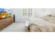 Bright bedroom with ample natural light, neutral colors, and stylish furniture at 9214 N Vicksburg Park Ct, Charlotte, NC 28210