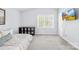 Cozy bedroom featuring a large window, neutral decor, and comfortable carpeting at 9214 N Vicksburg Park Ct, Charlotte, NC 28210