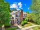 Beautiful home with lush landscaping and a brick chimney at 9214 N Vicksburg Park Ct, Charlotte, NC 28210