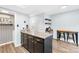 Charming kitchen island featuring granite countertops and dark wood cabinets at 9214 N Vicksburg Park Ct, Charlotte, NC 28210