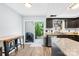 Bright kitchen with a sliding glass door and modern appliances at 9214 N Vicksburg Park Ct, Charlotte, NC 28210