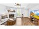 Comfortable living room with a fireplace, wood floors, and plenty of natural light at 9214 N Vicksburg Park Ct, Charlotte, NC 28210