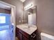 Bathroom featuring vanity, large mirror, and doorway to another bathroom at 1000 E Woodlawn Rd # 402, Charlotte, NC 28209
