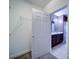View from the closet to the ensuite bathroom with dark cabinets at 1000 E Woodlawn Rd # 402, Charlotte, NC 28209