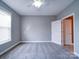 Bedroom featuring neutral walls, carpet and a bright window at 1000 E Woodlawn Rd # 402, Charlotte, NC 28209