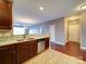 Modern kitchen featuring stainless steel appliances, granite countertops, and stylish cabinetry at 1000 E Woodlawn Rd # 402, Charlotte, NC 28209