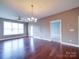 Bright and open living room featuring hardwood floors, modern fixtures, and natural light at 1000 E Woodlawn Rd # 402, Charlotte, NC 28209
