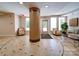Welcoming lobby showcases a central mosaic column, comfortable seating, and convenient access to building exits at 1000 E Woodlawn Rd # 402, Charlotte, NC 28209