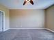 Spacious main bedroom with neutral walls and plush carpet at 1000 E Woodlawn Rd # 402, Charlotte, NC 28209