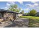 Backyard with a brick house and concrete pad at 1009 N Main St, Mount Holly, NC 28120