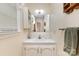 A half bathroom with a window and sink at 1009 N Main St, Mount Holly, NC 28120