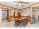 Cozy dining area with a classic wooden table and chairs, adjacent to the kitchen with tile floors at 1009 N Main St, Mount Holly, NC 28120