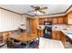 Functional kitchen and dining area, featuring wood cabinets and modern appliances at 1009 N Main St, Mount Holly, NC 28120