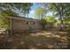 Backyard with brick house, fenced yard and storage shed at 1141 Carolina Cir, Statesville, NC 28677