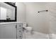 Modern bathroom featuring marble floors, a vanity, and black fixtures at 1141 Carolina Cir, Statesville, NC 28677