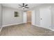 Neutral bedroom with wood floors, a ceiling fan, closet and a window offering natural light at 1141 Carolina Cir, Statesville, NC 28677