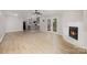 Spacious living room features wood flooring, a fireplace, and an open layout connected to the kitchen at 1141 Carolina Cir, Statesville, NC 28677