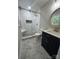 Elegant bathroom featuring a glass-enclosed shower with bench and stylish vanity at 117 Woodland Ave, Shelby, NC 28152