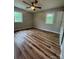 Bright bedroom with new flooring, a ceiling fan, and plenty of natural light at 117 Woodland Ave, Shelby, NC 28152
