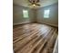 Inviting bedroom with new flooring, a ceiling fan, and plenty of natural light at 117 Woodland Ave, Shelby, NC 28152
