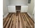 Desk area with white cabinets, countertop, new wood floors, and natural light at 117 Woodland Ave, Shelby, NC 28152