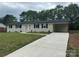 Beautifully renovated painted brick home with a convenient carport and a new driveway at 117 Woodland Ave, Shelby, NC 28152