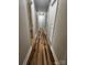 Hallway with new flooring and neutral paint, offering a seamless flow between rooms at 117 Woodland Ave, Shelby, NC 28152
