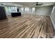 Spacious living room with new wood floors, fresh paint, recessed lighting, and an open layout at 117 Woodland Ave, Shelby, NC 28152