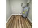 Utility room featuring a water heater and new wood floors at 117 Woodland Ave, Shelby, NC 28152