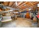 Unfinished basement space ready for customization and storage with concrete floor and exposed beams at 118 Spicewood Cir, Troutman, NC 28166