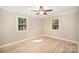 Bright bedroom with natural light from two windows and hardwood floors at 118 Spicewood Cir, Troutman, NC 28166