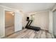 A bright bedroom with a window, workout equipment, and neutral decor at 118 Spicewood Cir, Troutman, NC 28166