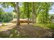 Traditional home with lush trees in front offers curb appeal and shade in a serene setting at 118 Spicewood Cir, Troutman, NC 28166