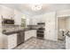 Bright, renovated kitchen featuring white cabinets, stainless steel appliances, and sleek countertops at 118 Spicewood Cir, Troutman, NC 28166
