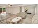 Inviting living room with hardwood floors, comfortable seating, and glass doors to the deck at 118 Spicewood Cir, Troutman, NC 28166