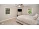 Comfortable main bedroom with natural light, a ceiling fan, and neutral color tones at 118 Spicewood Cir, Troutman, NC 28166