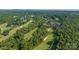 Expansive aerial view of a golf course community surrounded by lush greenery and well-maintained lawns at 1365 Winged Foot Dr, Denver, NC 28037