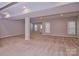 Spacious finished basement with neutral walls, carpeting, recessed lighting, and windows with blinds at 1365 Winged Foot Dr, Denver, NC 28037