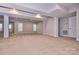 Spacious unfinished basement with carpet, several windows with blinds and recessed lighting at 1365 Winged Foot Dr, Denver, NC 28037