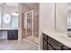 Bathroom featuring dual sinks, tile floors and a glass enclosed shower with a bench seat at 1365 Winged Foot Dr, Denver, NC 28037