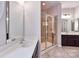 Bathroom featuring dual sinks, tile floors and a glass enclosed shower with a bench at 1365 Winged Foot Dr, Denver, NC 28037
