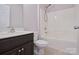 Bathroom with vanity, toilet, and shower-tub combo with white surround and chrome fixtures at 1365 Winged Foot Dr, Denver, NC 28037