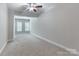 Bedroom featuring neutral walls, carpet, a ceiling fan, and a window with blinds at 1365 Winged Foot Dr, Denver, NC 28037
