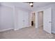 Bedroom featuring neutral walls, carpet, closet and doorway leading to a connected bathroom at 1365 Winged Foot Dr, Denver, NC 28037