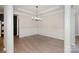 Classic dining room with wainscoting, hardwood floors, elegant lighting, and refined details at 1365 Winged Foot Dr, Denver, NC 28037