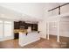 Modern kitchen features granite counters, dark cabinetry and stainless steel appliances at 1365 Winged Foot Dr, Denver, NC 28037